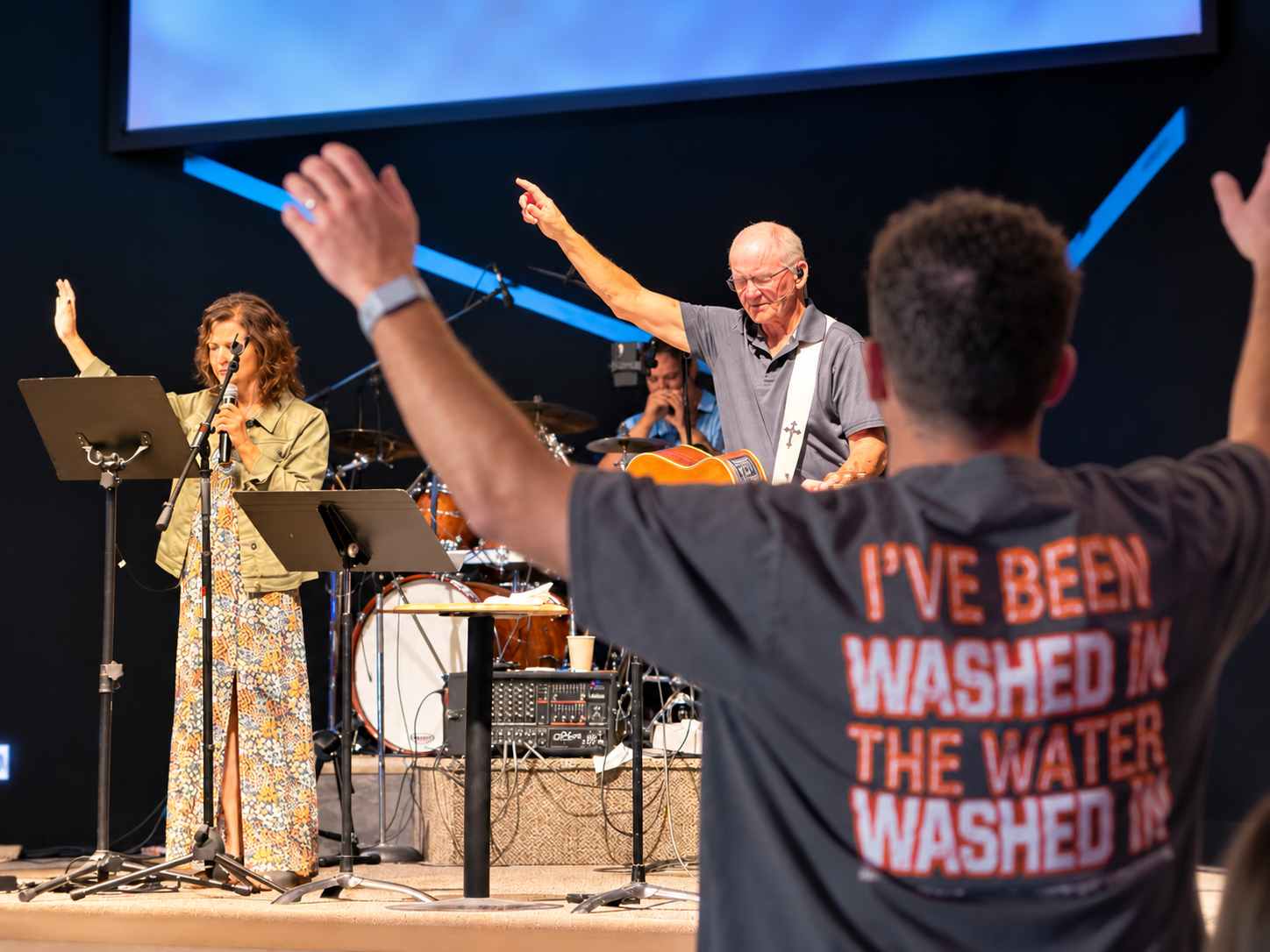 Pastor John leading worship at Rocanville Pentecostal Church
