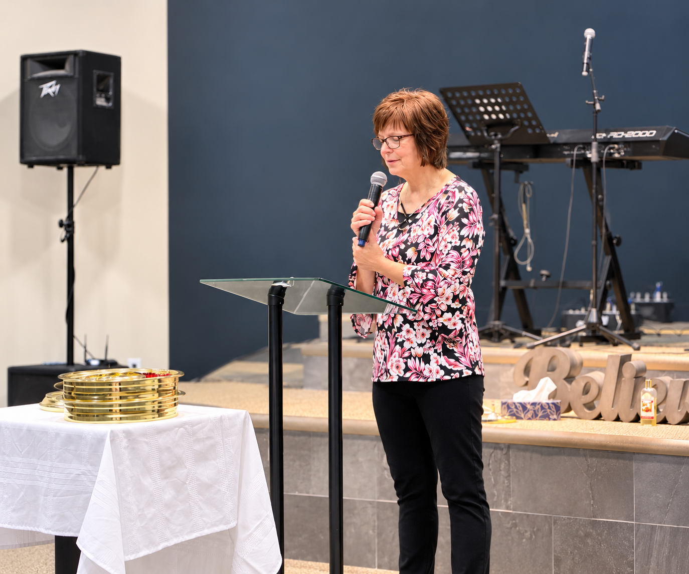 Pastor Lorna speaking at the pulpit